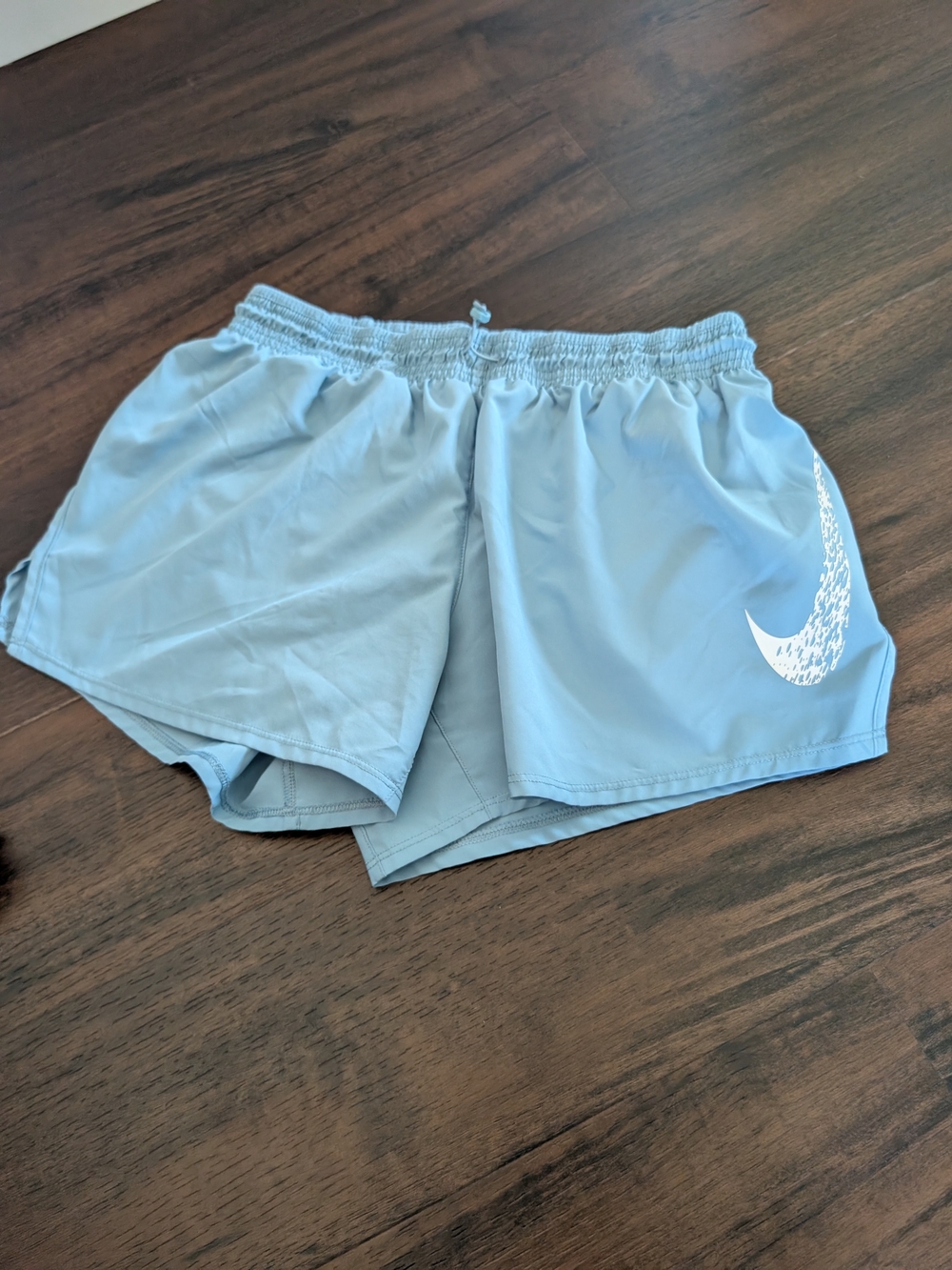 Nike Women’s Light Blue Athletic Running Shorts with White Swoosh